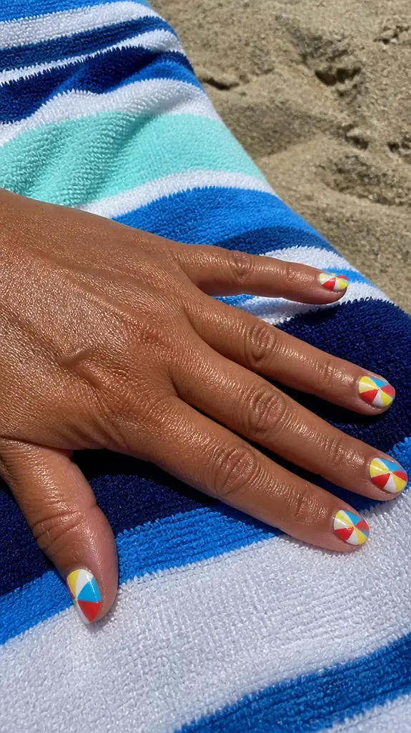 beach ball nails with red, yellow and blue wedges on a woman's hand