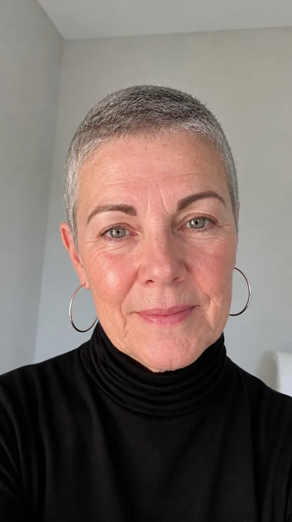 woman in her sixties with a very short cropped haircut