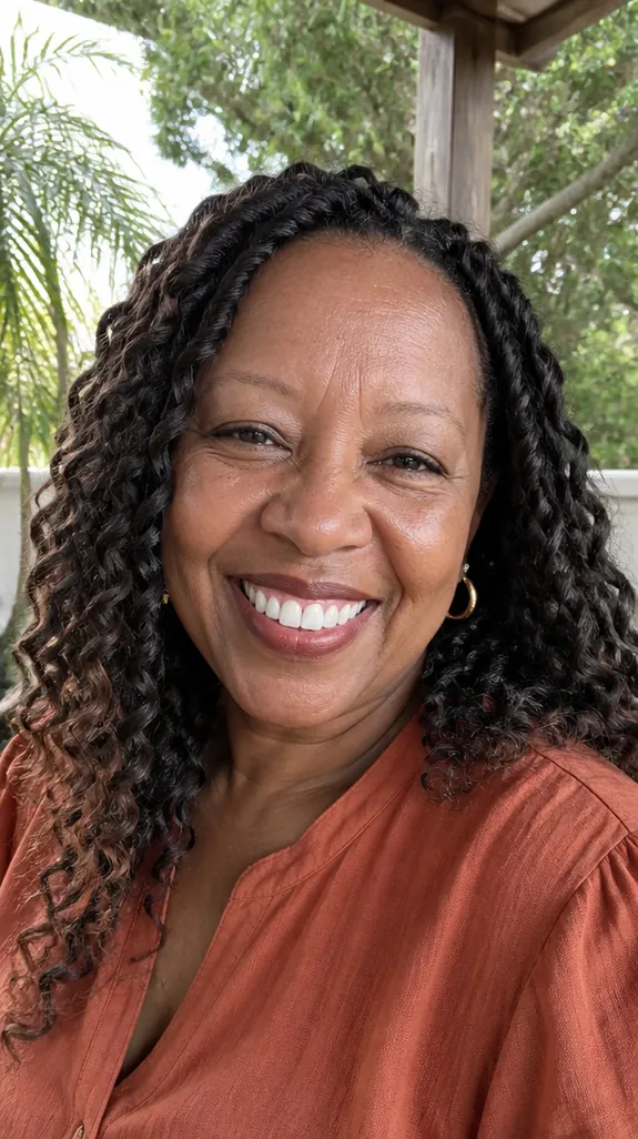Black woman over 50 with shoulder-length passion twists